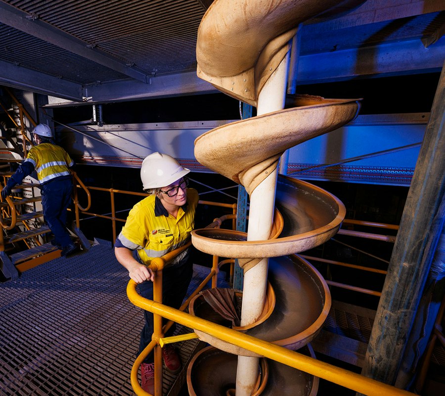 Technician inspecting a Mineral Technologies mtSpirals gravity spiral